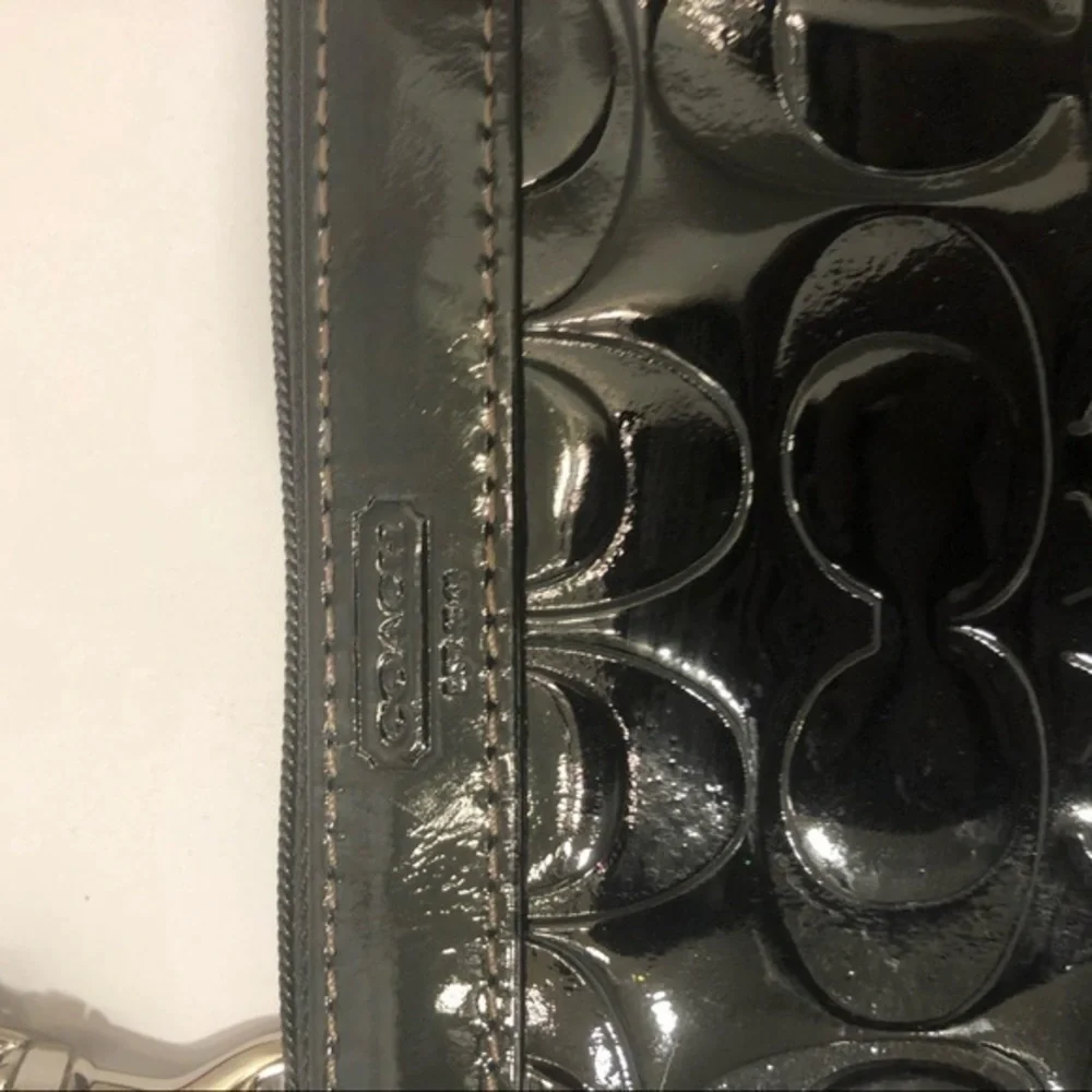 Coach embossed black leather wristlet clutch bag